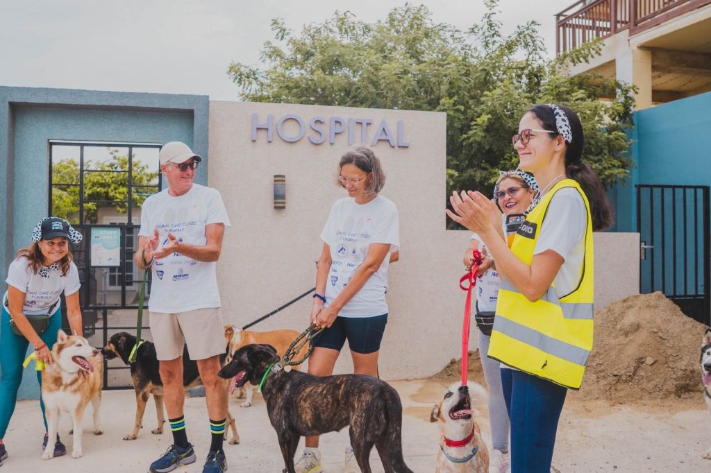 Fun walk participants and their dogs gathering at the Animal Care Clinic Aruba hospital entrance