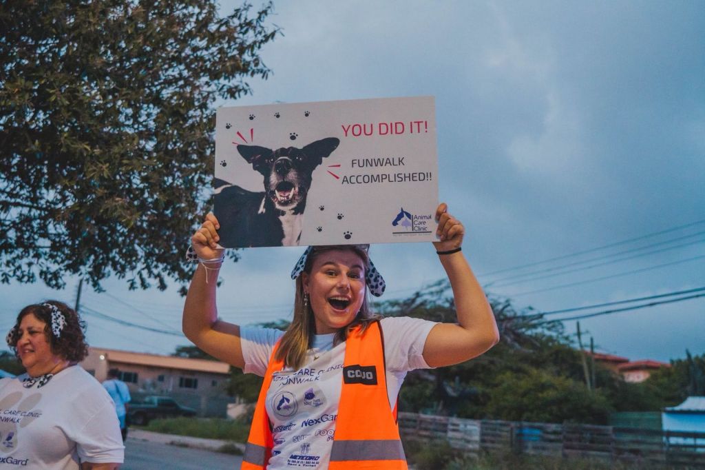 Volunteer celebrating the finish of the Animal Care Clinic Aruba Fun Walk